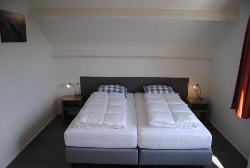 Postel nebo postele na pokoji v ubytování Villa Dunopark 49
