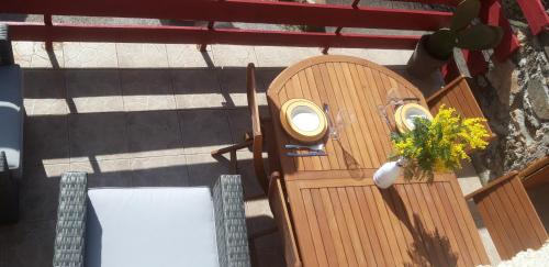 an overhead view of a table and chairs on a patio at Gîtes chez Daniel "Cevennes 2" in Mars