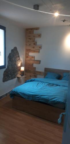 Ένα ή περισσότερα κρεβάτια σε δωμάτιο στο Gîtes chez Daniel "Cevennes 2"