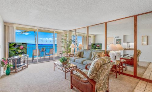 a living room with a couch and a table at Royal Kahana 309 1 Bedroom Condo condo in Kahana