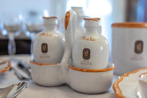 two bottles of milk sitting on a table at Relais Borgo Segine in Melendugno