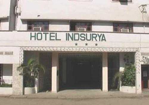 a hotel insignia on the front of a building at Hotel Indsurya in Dibrugarh