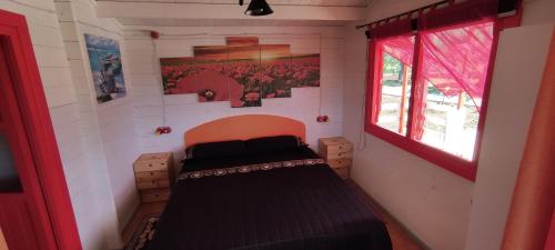 Postel nebo postele na pokoji v ubytování Natur House da Mary