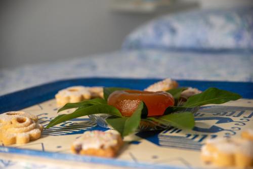 a blue plate of food on a table at Sisinedda in Siniscola