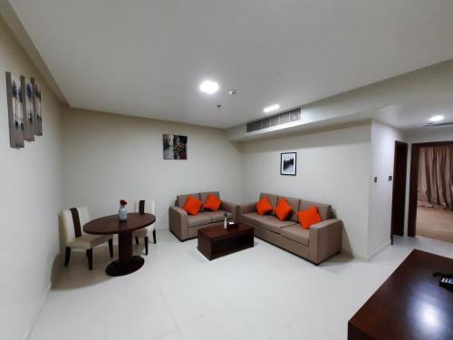 a living room with a couch and a table at SBY Hotel فندق اس بي واي in Jeddah