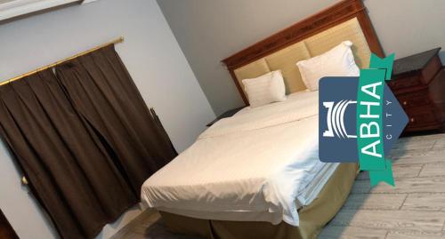 Cama o camas de una habitación en Bait Alsadaqa Aparthotel