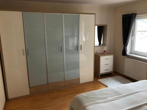 Katil atau katil-katil dalam bilik di Ferienwohnung Stiftsgartenblick