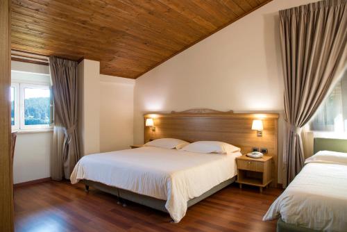 Postel nebo postele na pokoji v ubytování Hotel Park 108 Sport&Wellness