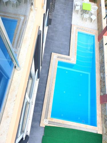 an overhead view of a swimming pool in a building at Home Mood Apart Hotel in Antalya