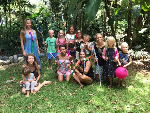 a group of children are posing for a picture at Cafe de la Suerte in Pavones