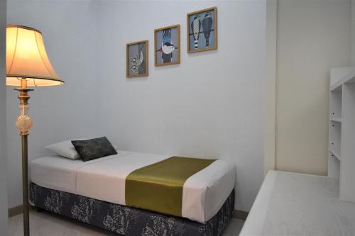 Postel nebo postele na pokoji v ubytování Nest Residence
