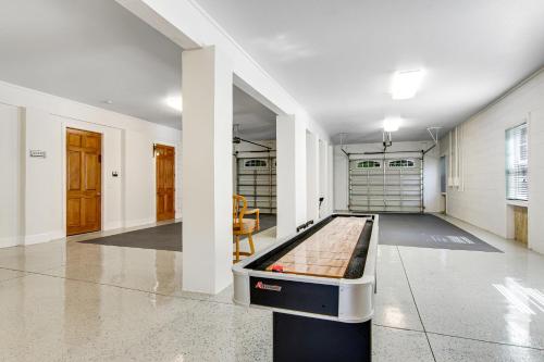 a room with a pool table in the middle of it at Restful Adventure On The Coast in Harrington