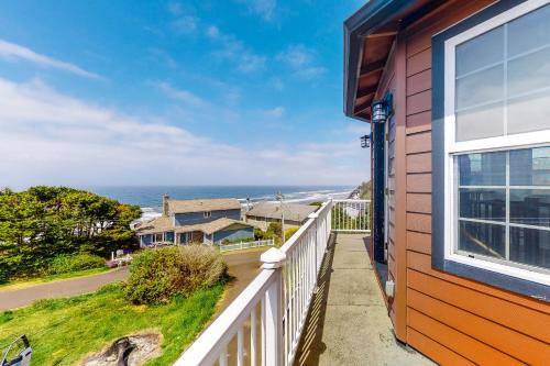 a view of the ocean from the balcony of a house at Lighthouse View in Lincoln City