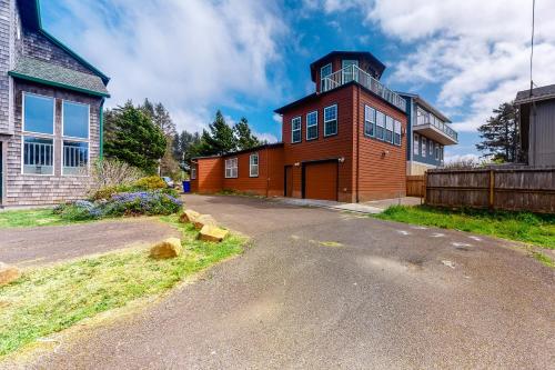 a brick building with a tower on top of it at Lighthouse View in Lincoln City