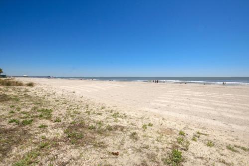 a view of a beach with people in the ocean at Sands Beach Club in Myrtle Beach