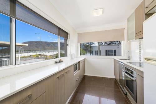 Η κουζίνα ή μικρή κουζίνα στο H2O Holiday Apartments Unit 5