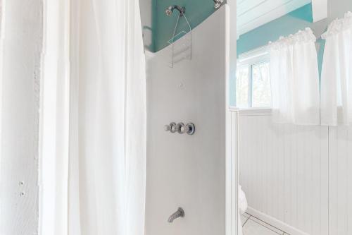 a bathroom with a shower with a shower curtain at Bethany West - 609 Brookview in Bethany Beach