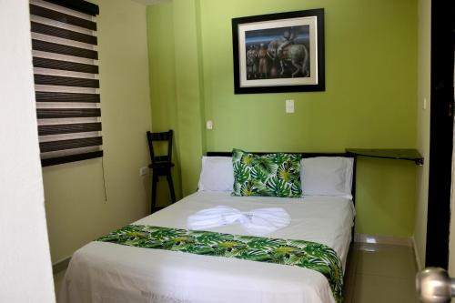 Postel nebo postele na pokoji v ubytování Hotel Ecosuite Quibdó