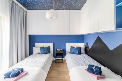 Posteľ alebo postele v izbe v ubytovaní Apartament Nad Potokiem Skrzyczne Residence