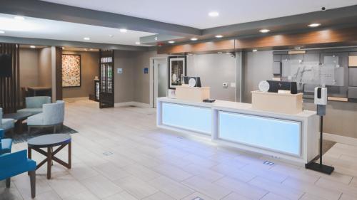 a lobby of a store with a counter and chairs at Holiday Inn Express Lompoc by IHG in Lompoc