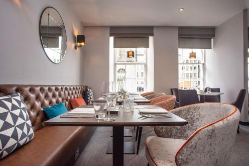 a dining room with a table and chairs at Ten Hill Place in Edinburgh