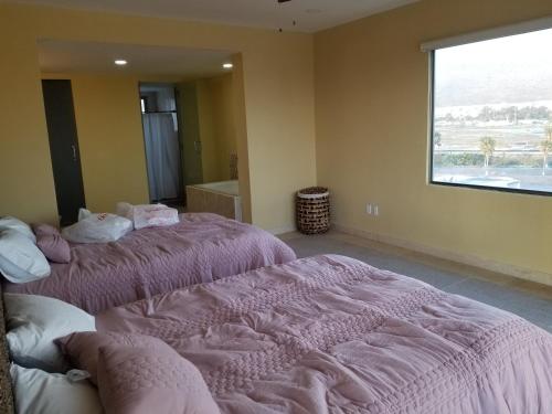 Postel nebo postele na pokoji v ubytování Condominio Paraiso