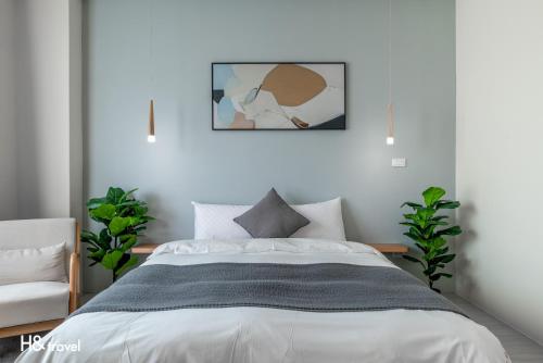 Ένα ή περισσότερα κρεβάτια σε δωμάτιο στο H& Taitung Feng Lin Resort Hotel