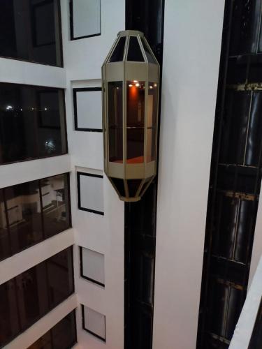 a street light on the side of a building at SRM Hotel Trichy in Tiruchchirāppalli