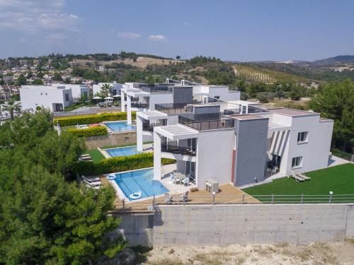 an aerial view of a house with a swimming pool at Exclusive Villas in Kusadası