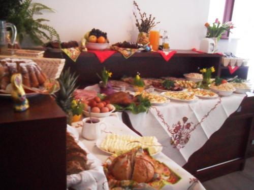 a table with many different types of food on it at Willa Stożek, 50 m od term i wyciągów narciarskich in Białka Tatrzanska