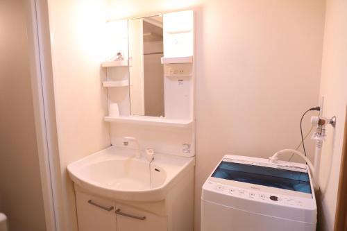 Kúpeľňa v ubytovaní ケイアイコンホテルズ 新栄301