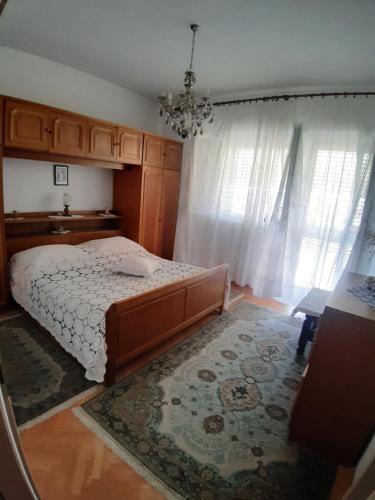 Postel nebo postele na pokoji v ubytování Apartmani Luce