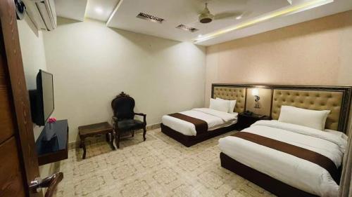 Postel nebo postele na pokoji v ubytování Golden Sand Hotel Rahim Yar Khan