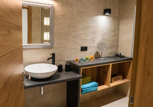 a bathroom with a sink and a mirror at Zelena dolina in Cerkno