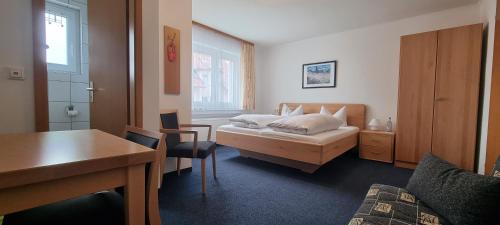 Postel nebo postele na pokoji v ubytování Hotel Seehalde