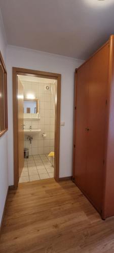 an empty room with a bathroom with a shower at Hotel Seehalde in Nonnenhorn