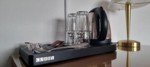 a black counter with a blender on a table at Hotel Seehalde in Nonnenhorn