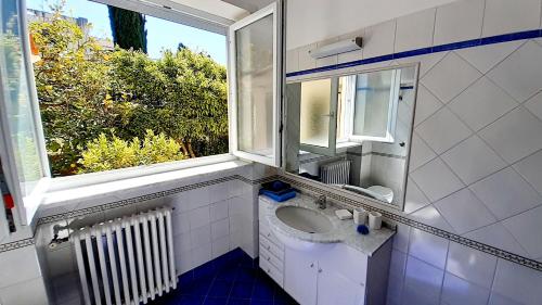 a bathroom with a sink and a window at Villa Dorothee in Capri