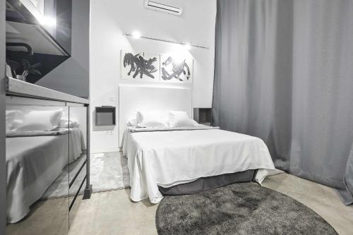 A bed or beds in a room at Dulce modern & luxury