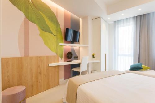 מיטה או מיטות בחדר ב-Hotel Bellavista - Boutique Hotel