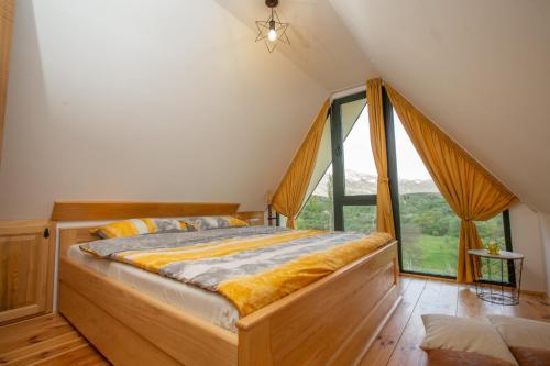 A bed or beds in a room at Cozy House Ostrog