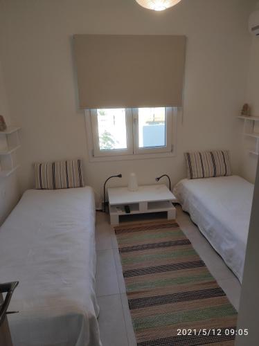 Llit o llits en una habitació de Seaside Jacaranda