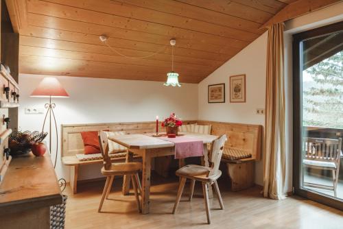 a dining room with a table and chairs at Landhaus Elke in Reith bei Seefeld