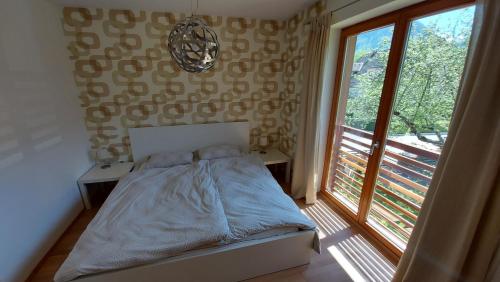 Postel nebo postele na pokoji v ubytování Apartments Supermjau