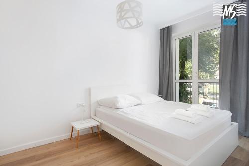 Posteľ alebo postele v izbe v ubytovaní MS Apartments Kopernicus II