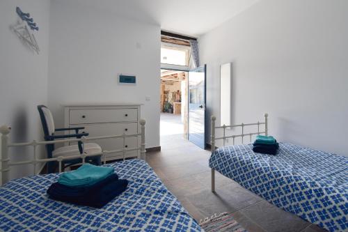 Ένα ή περισσότερα κρεβάτια σε δωμάτιο στο Quinta da Borboleta