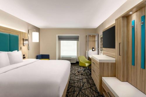 Una cama o camas en una habitación de Wingate by Wyndham Murfreesboro-NEAR MTSU