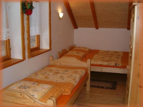 Кровать или кровати в номере Motylek 8