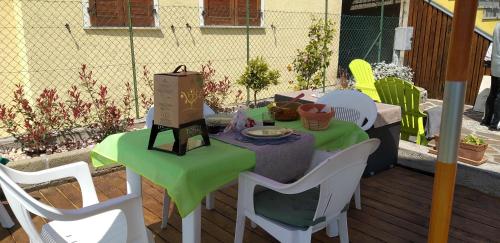a table and chairs sitting on a patio at CASA MAGIA in Tremosine Sul Garda