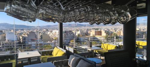 a restaurant with a view of the city at Ariston Hotel in Athens